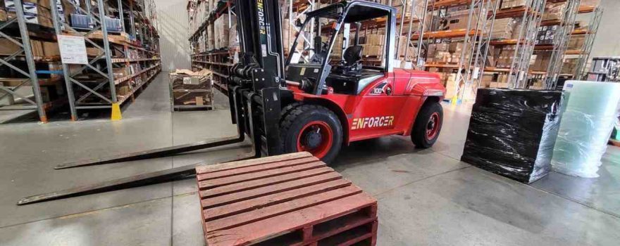 FMCG distribution warehouse with forklifts and palletised goods