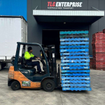 Online fulfilment centre with forklift handling stacked orders beside a delivery truck